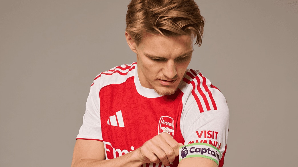 Martin Odegaard pulls on his captain's armband